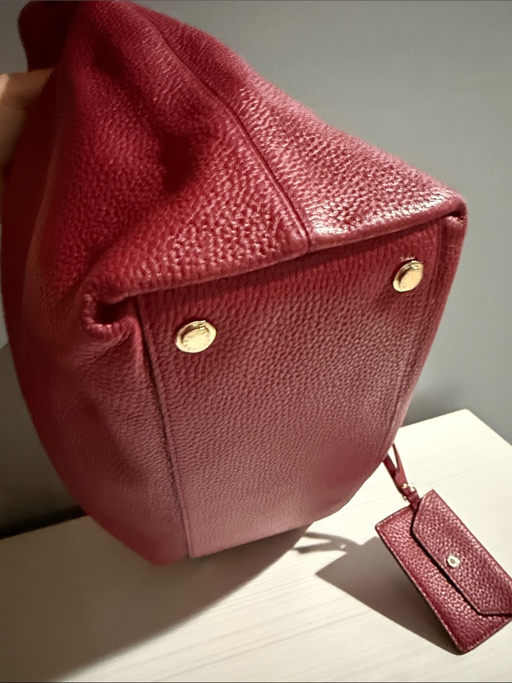 Henri Bendel tote bag features a pebbled texture and gold-toned hardware. - Picture 6 of 11